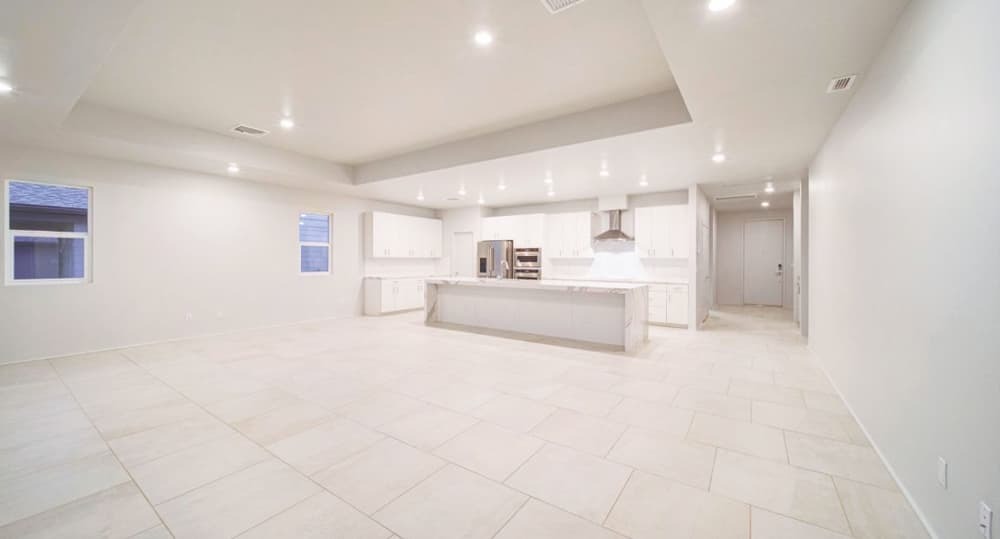 A corner shot of the entire kitchen and living area in Plan 21.