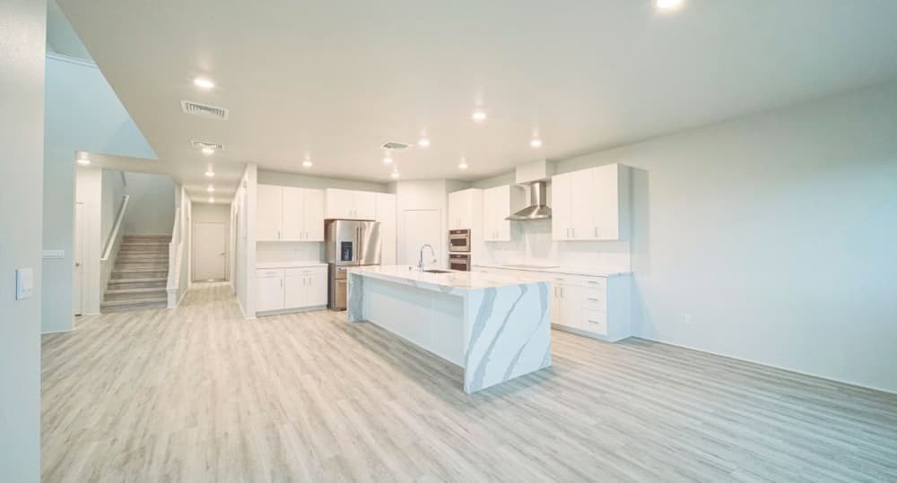 The stairways next to the kitchen in Plan 23.