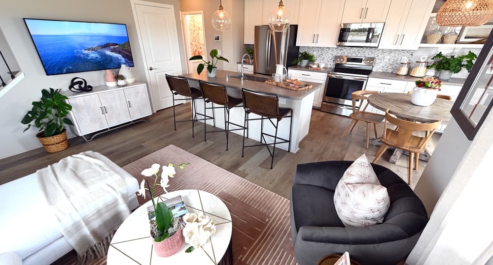 A staged living room and kitchen in Luana (Plan 4).